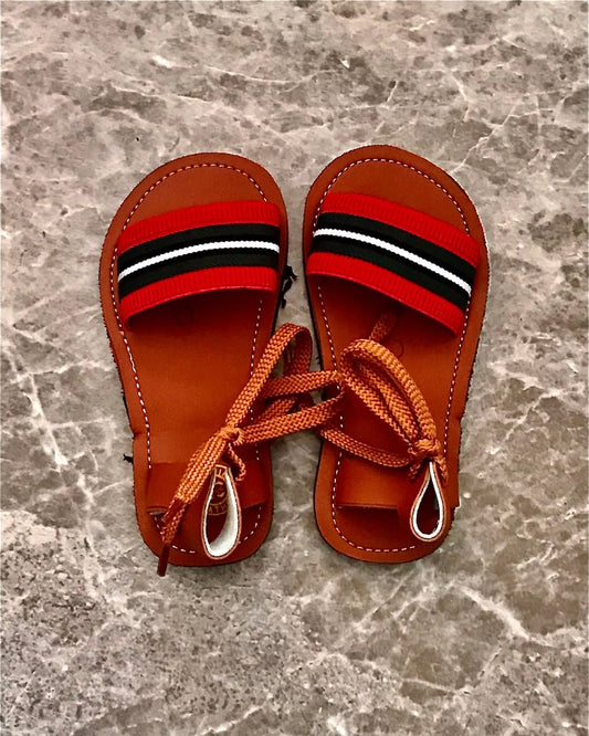 Tiny Kenyan Sandals – A Playful Symbol of Heritage and Pride.