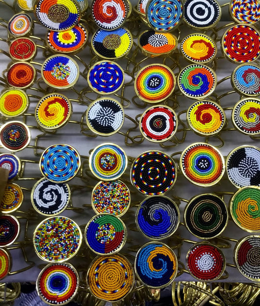 Authentic Maasai Brass and Beaded Bangles – ‘Enkanyit’ (Respect) Spiral Series in Multicolor.