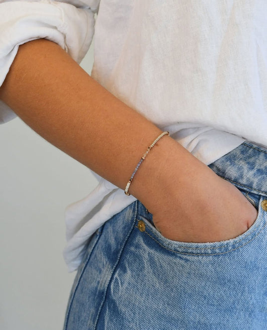 Authentic Maasai Beaded Bracelet – ‘Uzazi’ (Motherhood) in Indigo, Cream, and Gold.