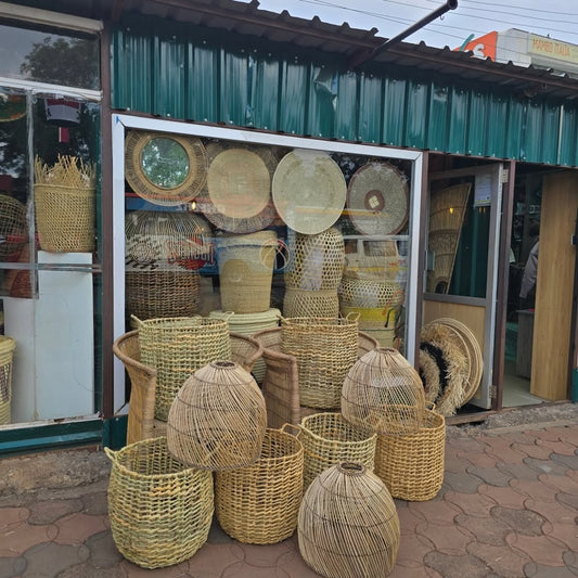 Artisan Streetfront Ensemble – Woven Forms and Illuminated Craft – Enkito e Ang’ (Step of Light).