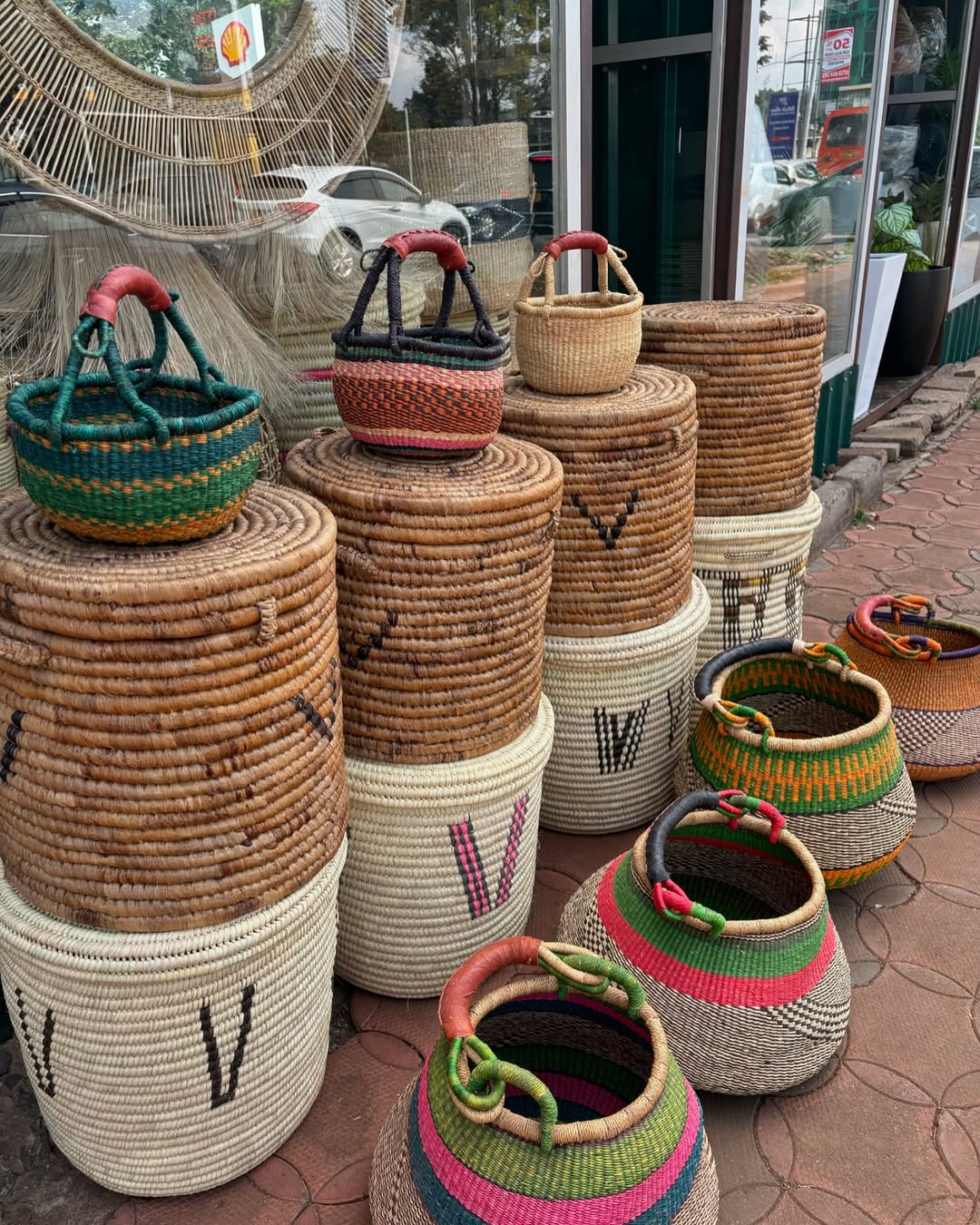 Stacked Basket Ensemble on Sidewalk - Circle of Color & Commerce – Enkito e Oltau (Step of Offering).