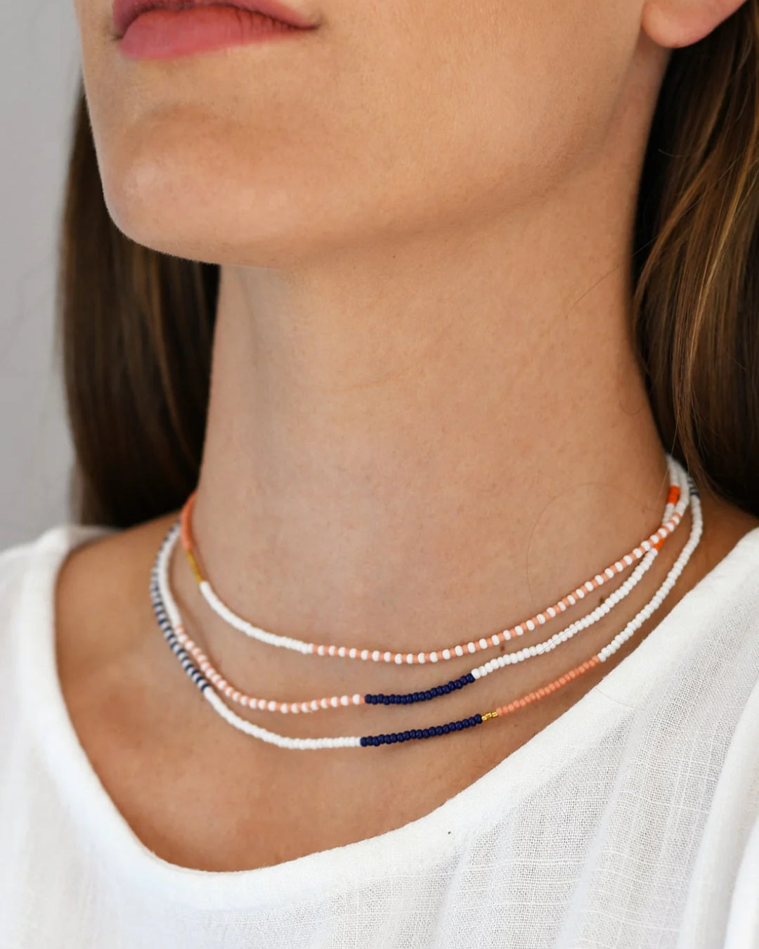 Trio Segmented Chokers in Ivory, Coral, and Indigo - Rhythm of Layer & Light – Enkito e Olkereti (Step of Adornment).